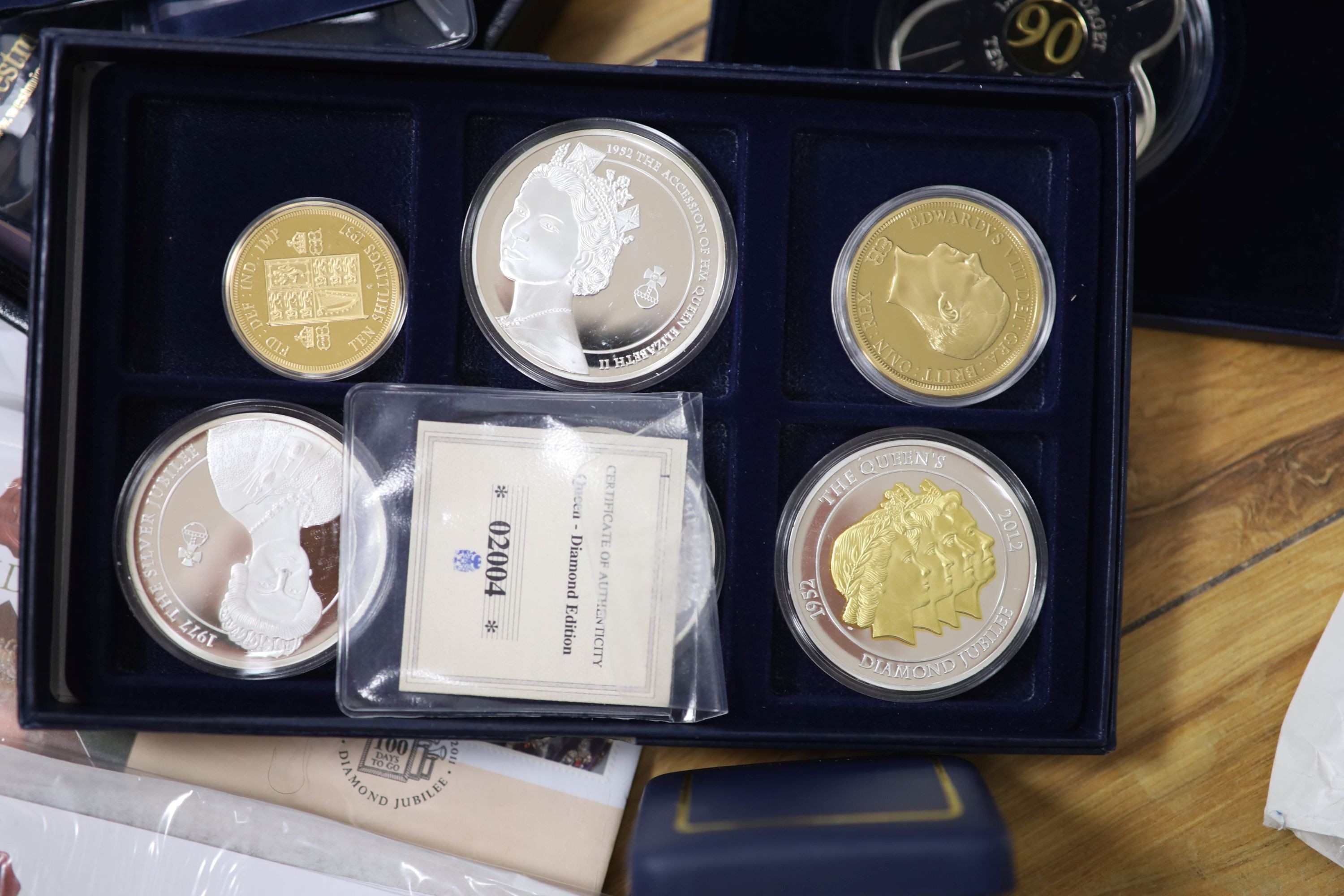 A collection of Westminster & Royal Mint QEII commemorative coins, some silver issues